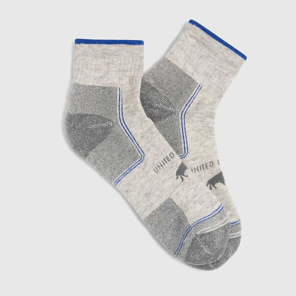 Grey Bison Trail Quarter Sock (Flat-lay): Pair of light grey quarter socks with blue trim and bison logo
