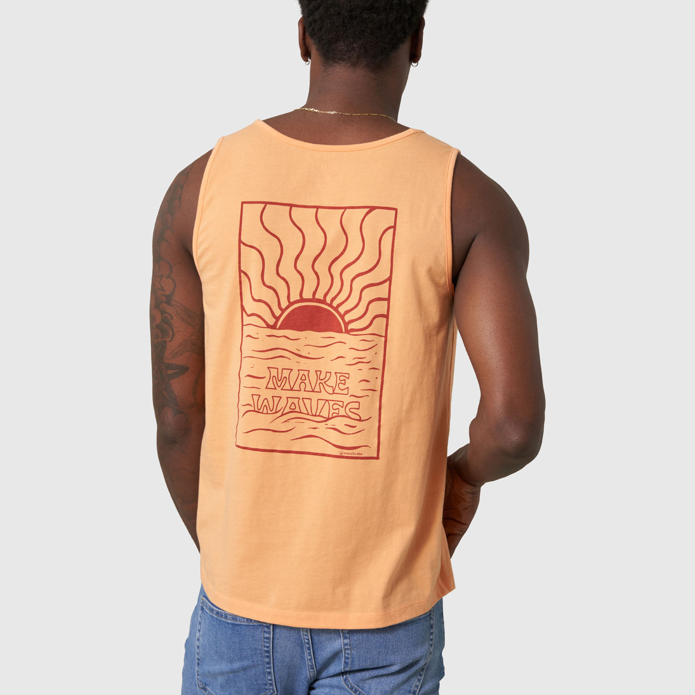 Make Waves Papaya Graphic Tank (Back): Peach sleeveless tank, back graphic of sunset over waves with text