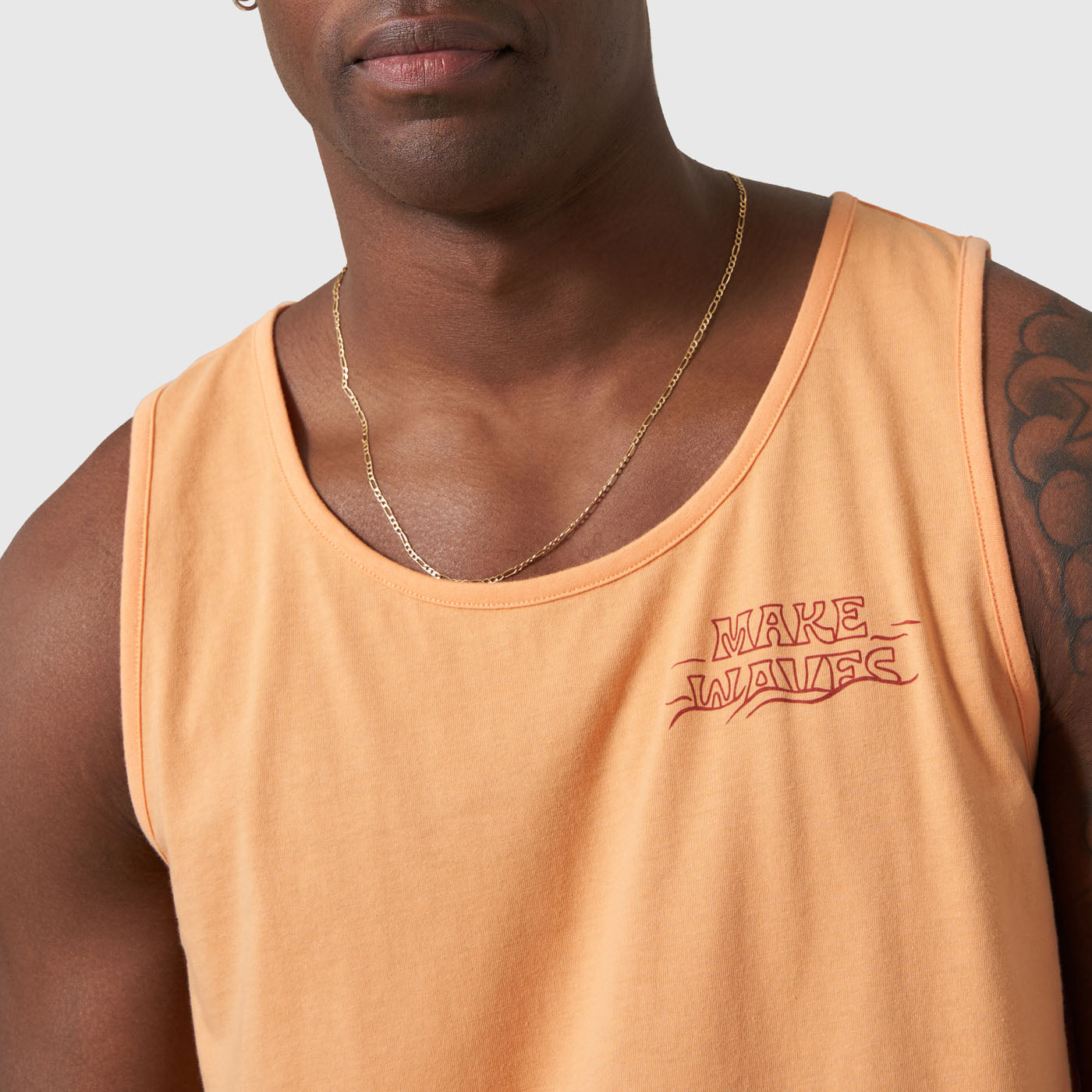 Make Waves Papaya Graphic Tank (Detail): Peach sleeveless top with red Make Waves logo on left chest