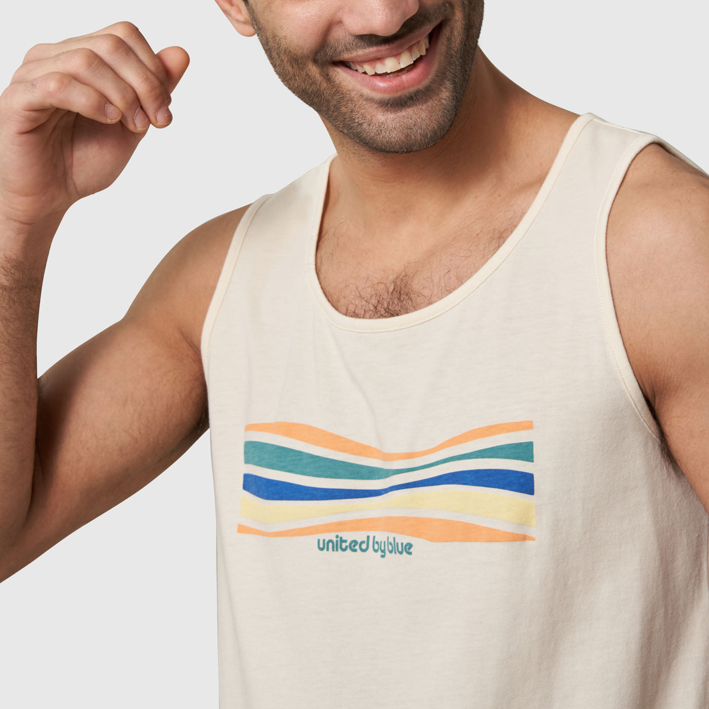 Graphic Tank (In-use): Off-white sleeveless tank with colorful wavy stripes graphic and brand logo