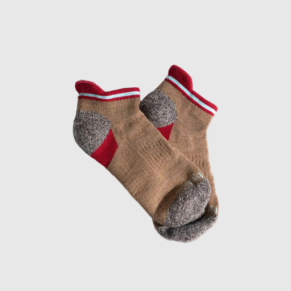 Camel Stripe Merino Wool - Low Cut Sock (Angle): Tan ankle socks with red cuff stripe, gray heel and toe reinforcement