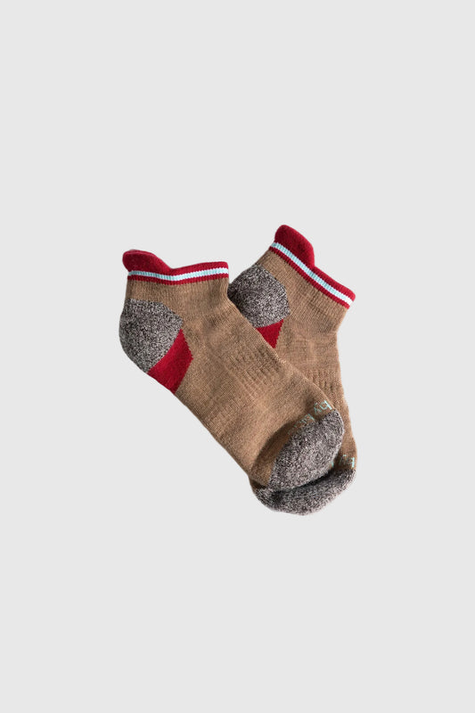 Camel Stripe Merino Wool - Low Cut Sock (Angle): Tan ankle socks with red cuff stripe, gray heel and toe reinforcement