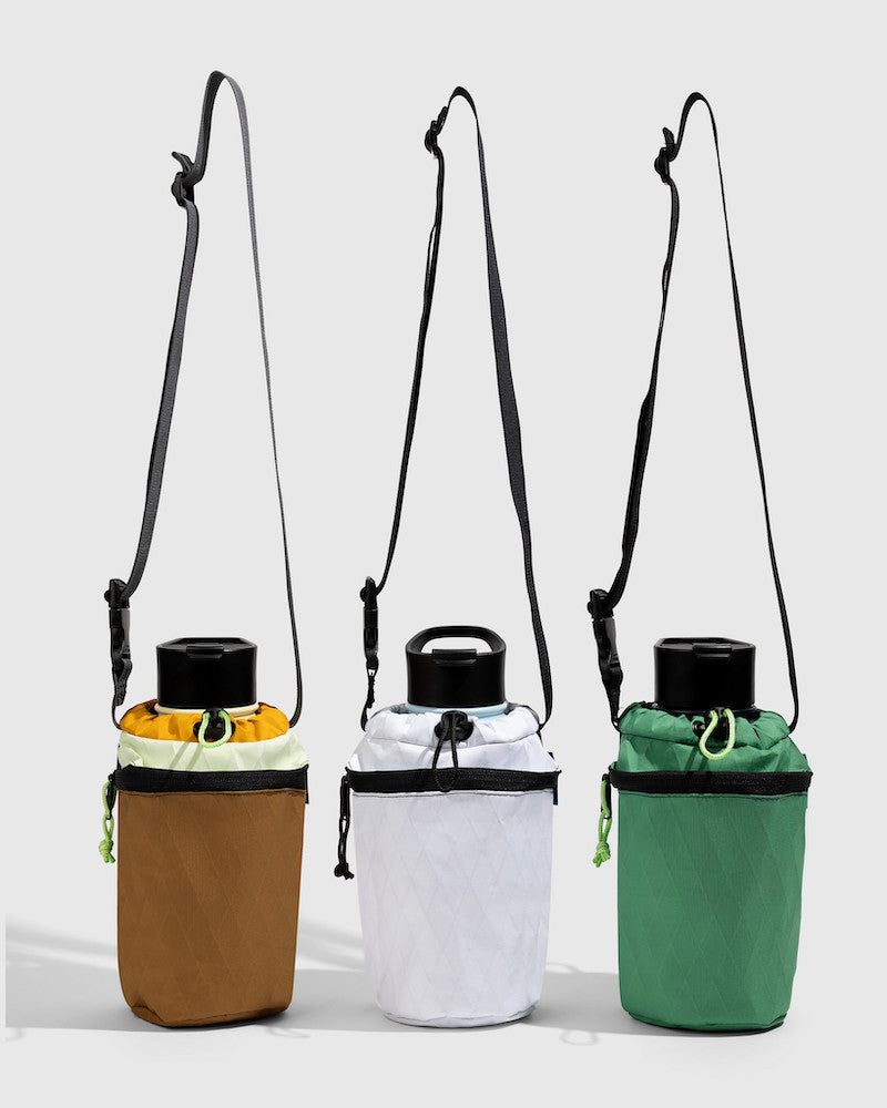 Water Bottle Sling - Westward (Pre-Release) (Front): Three insulated bottle slings in tan, white, and green with crossbody straps