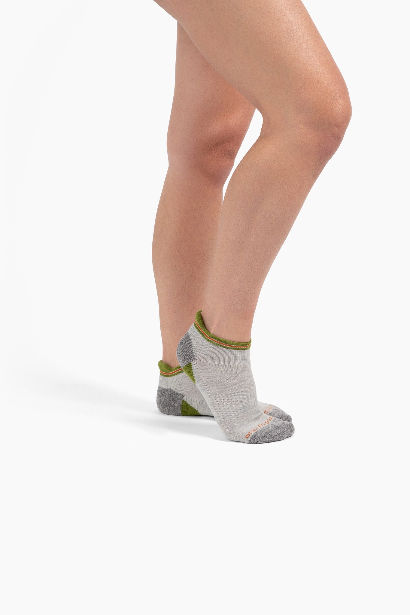 Grey Stripe Merino Wool - Low Cut Sock (In-use): Light grey ankle socks with olive green heel tab and grey toe worn on bare legs