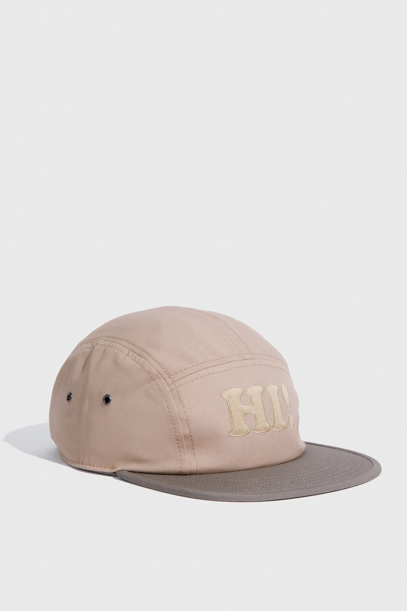 Tan Hi Organic 5-Panel Hat (Angle): Tan five-panel cap with gray brim and tonal embroidered lettering