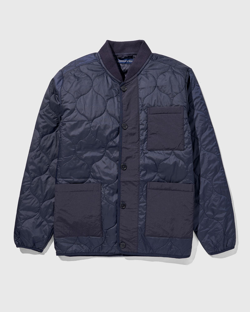 Night Sky Bison Ultralight Liner Jacket (Flat-lay): Navy quilted button-front jacket with ribbed collar and three patch pockets