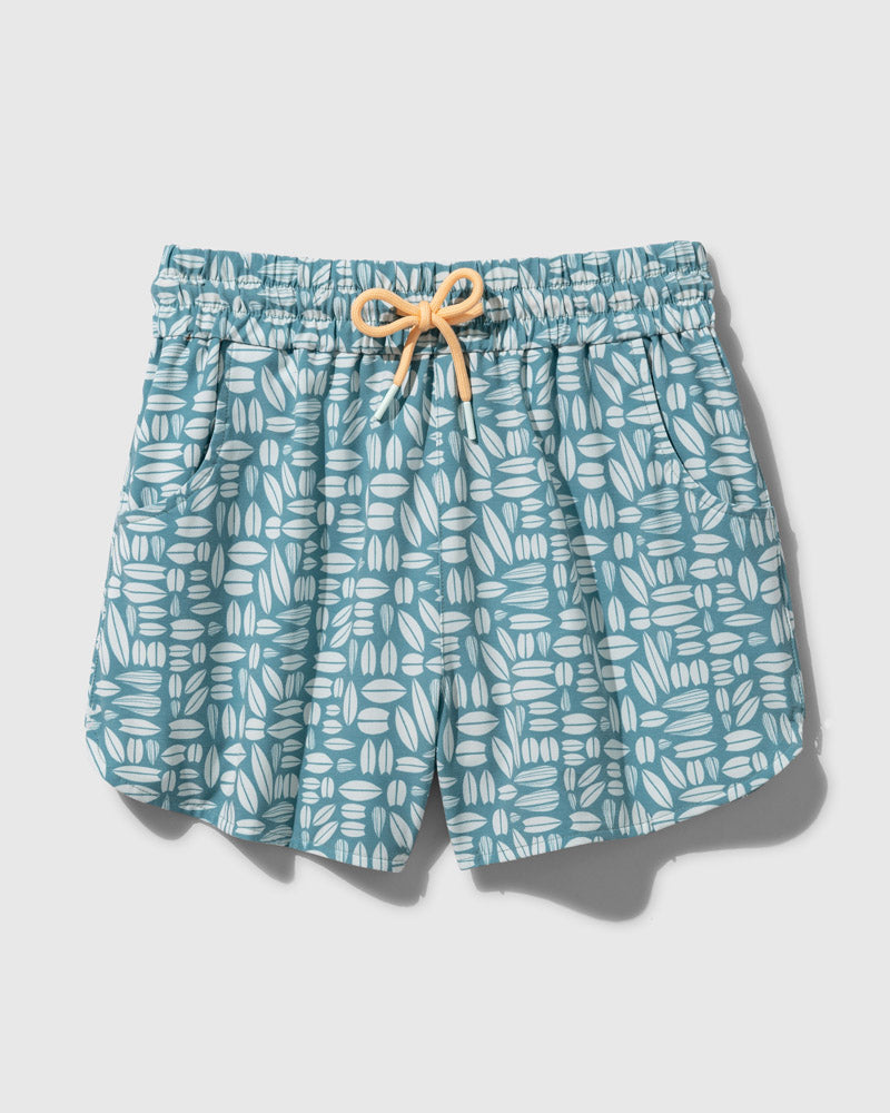 Teal The Responsible Swim Short (Flat-lay): Teal swim shorts with white surfboard print and peach drawstring tie