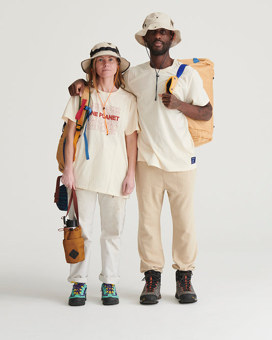 Bone Organic Bucket Stash Hat (In-use): Two people wearing cream bucket hats with outdoor gear, studio background