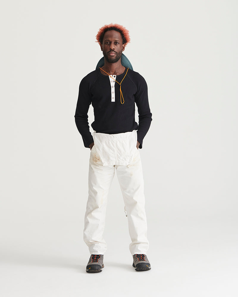 Sky Blue Organic Bucket Stash Hat (In-use): Man wearing sky blue bucket hat folded down around neck, standing upright