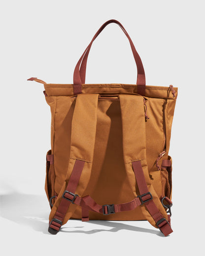 Camel (R)evolution™ 25L Convertible Carryall (Back): Camel canvas bag showing padded backpack straps, buckles, and tote handles