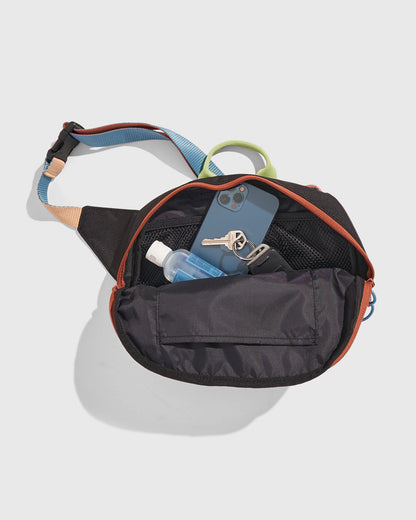 Black Multi (R)evolution™ 3L Utility Fanny Pack (Detail): Open fanny pack revealing phone, keys, hand sanitizer, and interior pockets