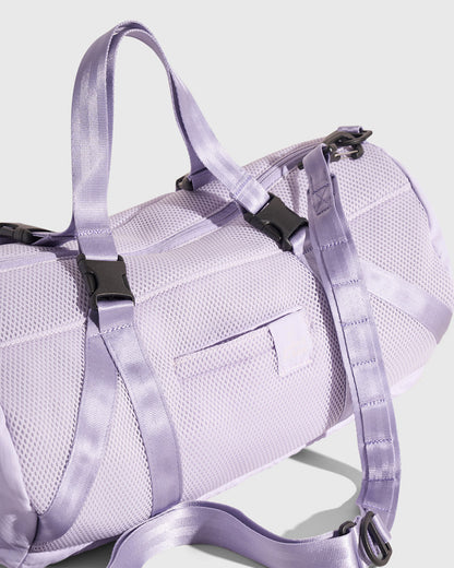 Lavender (Re)active™ 16L Mini Duffle (Detail): Light purple mesh duffle bag showing top handles, buckle clips, and shoulder strap hardware