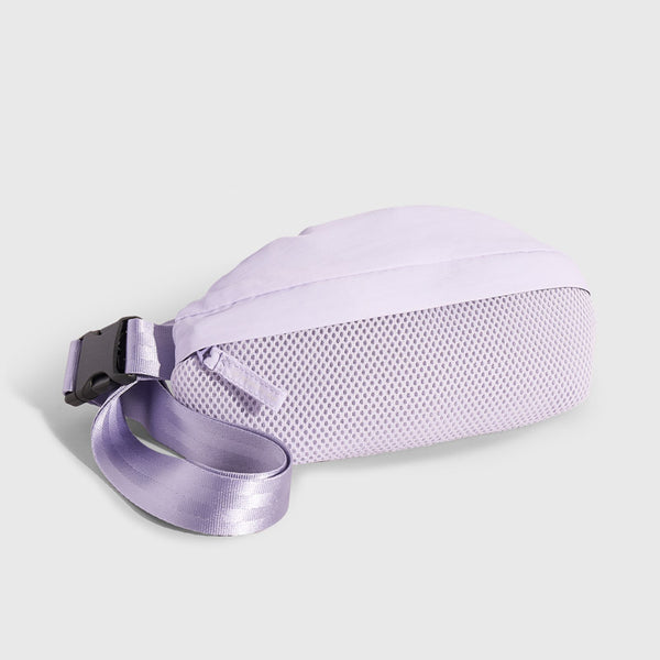 Lavender (Re)active™ 1L Fanny Pack (Angle): Light purple fanny pack showing mesh bottom panel and adjustable buckle strap