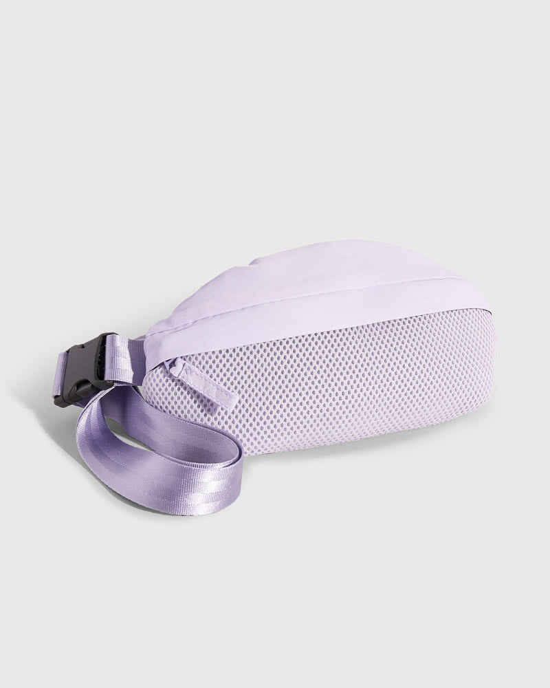Lavender (Re)active™ 1L Fanny Pack (Angle): Light purple fanny pack showing mesh bottom panel and adjustable buckle strap