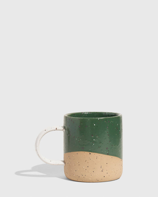 Pine 8 oz. Stoneware Mug (Angle): Dark green glazed upper half, unglazed speckled tan lower half, white handle