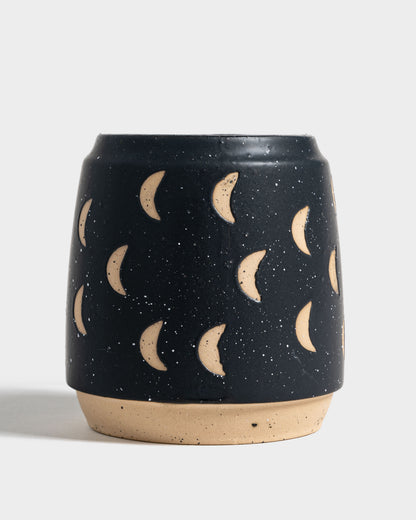 Nightfall Blue 16 oz. Stoneware Mug (Front): Dark navy speckled mug with carved crescent moon motifs and unglazed base