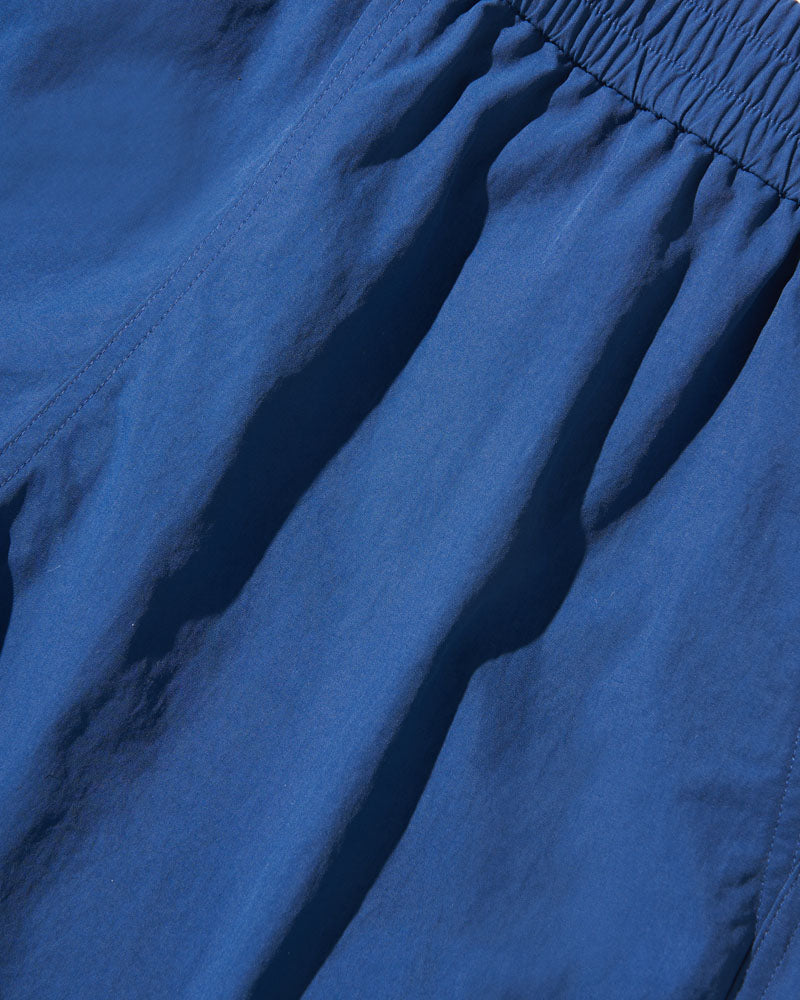 Estate Blue Recycled Sport Short (Detail): Close-up of blue elastic waistband and lightweight fabric with subtle seam