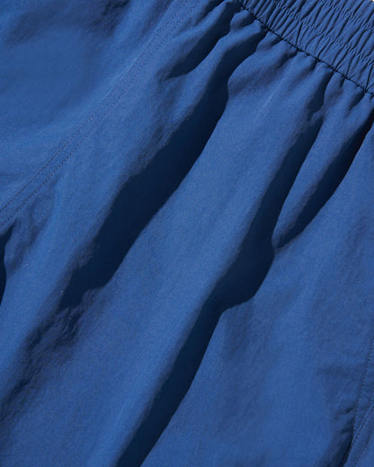Estate Blue Recycled Sport Short (Detail): Close-up of blue elastic waistband and lightweight fabric with subtle seam