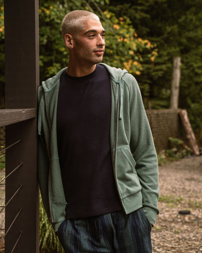 Sudadera orgánica con capucha y cremallera tipo raglán