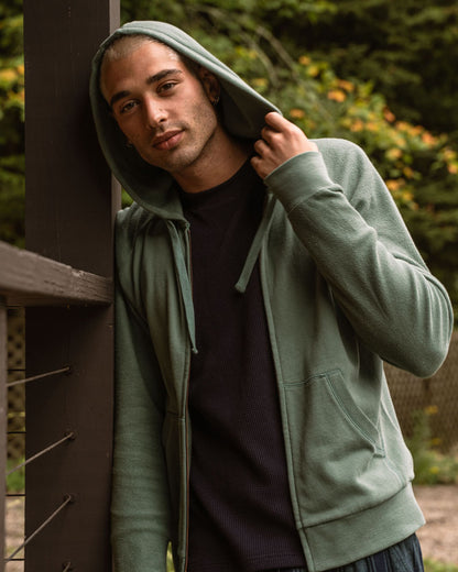 Sudadera orgánica con capucha y cremallera tipo raglán