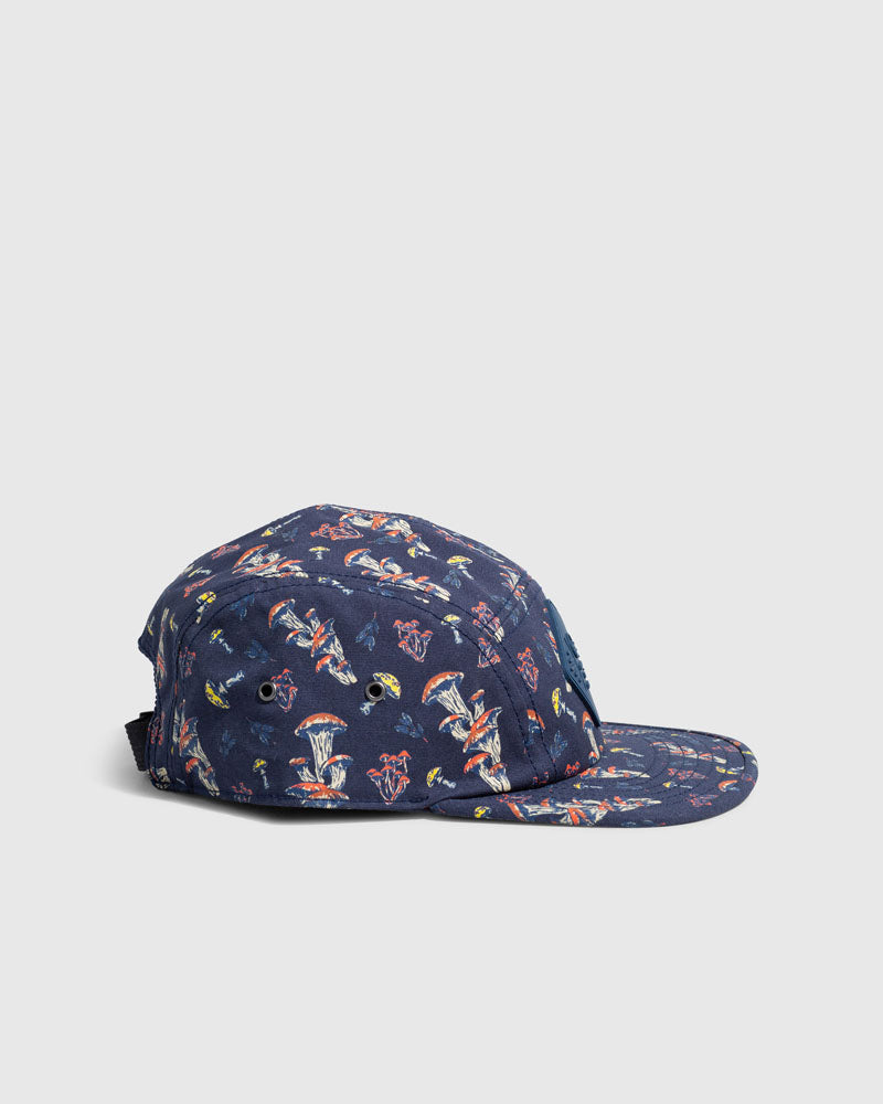 Navy Mushrooms Organic 5-Panel Hat (Side): Navy five-panel cap with colorful mushroom print and adjustable back strap
