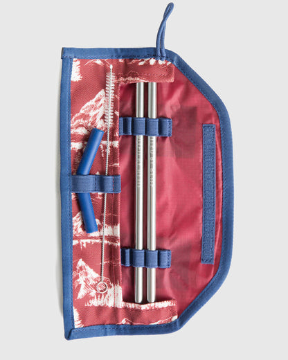Sapphire The Straw Kit (Flat-lay): Open blue and red mountain-print case holding two metal straws and cleaning brush