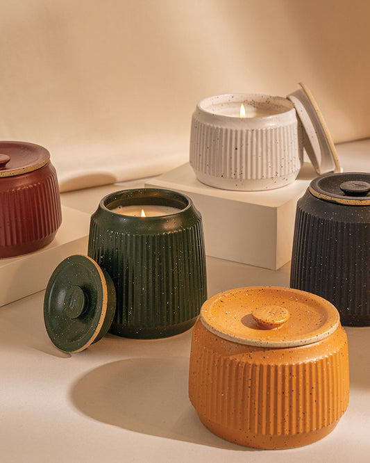CARAMEL 14 oz. Ceramic Keepsake Candle - Mountain Peak (Lifestyle): Ribbed ceramic candle jars in five colors, two with lit wicks