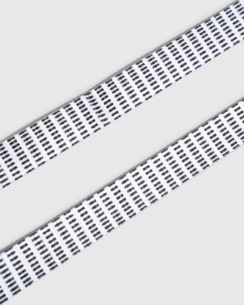 Shortbread (R)evolution™ Recycled Woven Dog Leash (Detail): Close-up of white woven strap with dark grid-pattern stitching throughout