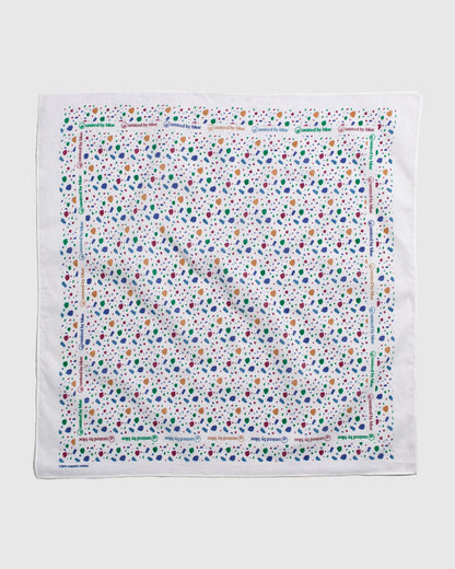 Egret Organic Bandana (Flat-lay): White bandana with multicolor abstract spots and repeated brand text border
