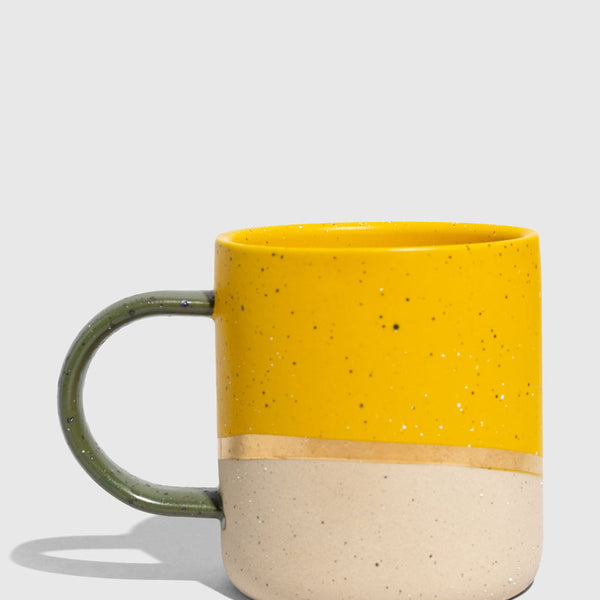 Butterscotch 8 oz. Stoneware Mug (Angle): Yellow speckled upper half, bare clay lower half, olive green handle