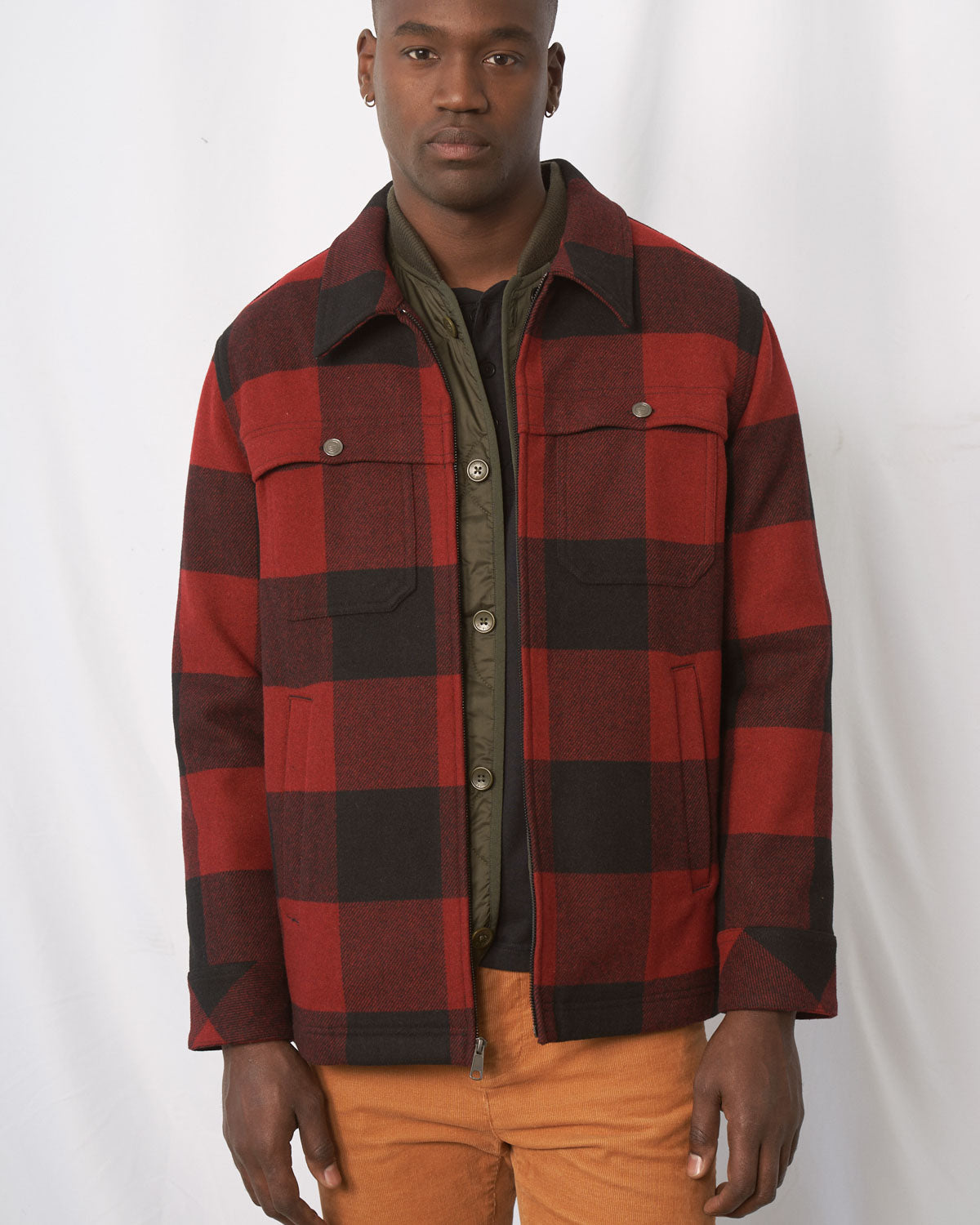 Forest Floor Bison Ultralight Liner Jacket (In-use): Olive zip-up liner jacket worn open, buttoned front, neutral background