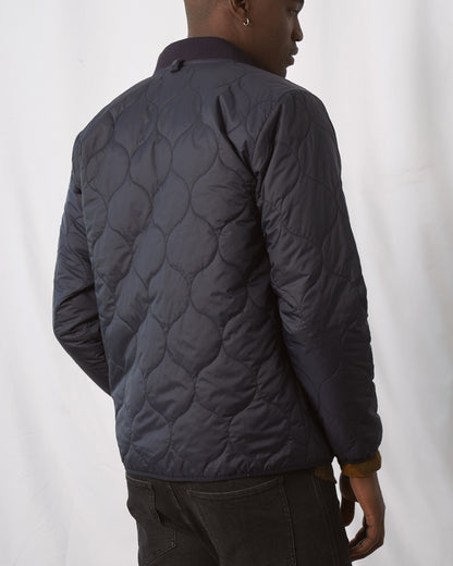 Night Sky Bison Ultralight Liner Jacket (Back): Dark navy quilted jacket with onion-shaped stitch pattern, ribbed collar