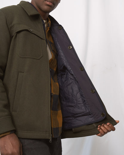 Night Sky Bison Ultralight Liner Jacket (Detail): Dark navy quilted interior lining with buttons shown open on olive jacket