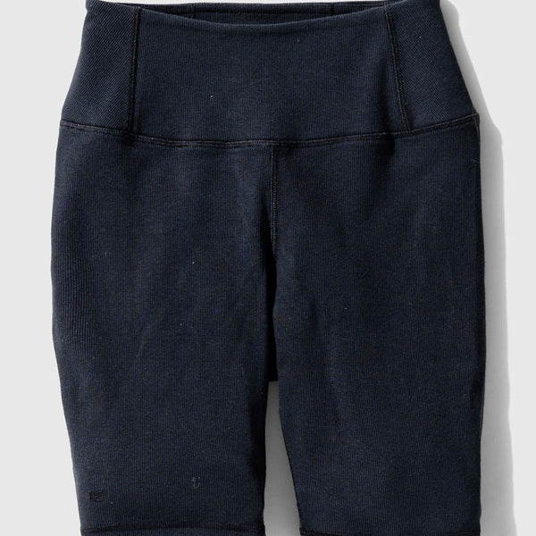 Black EcoKnit™ Ribbed Bike Short (Flat-lay): Dark navy ribbed bike shorts with wide waistband and side pockets