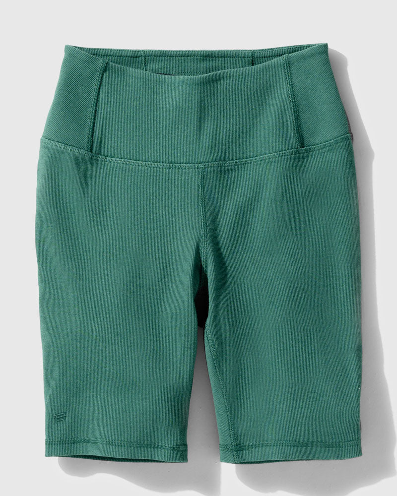 Jade EcoKnit™ Ribbed Bike Short (Flat-lay): Teal ribbed bike shorts with wide waistband and side pockets