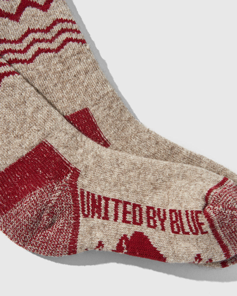 Red The Ultimate Bison Wool Sock (Detail): Close-up of oatmeal and red wool sock showing United By Blue logo