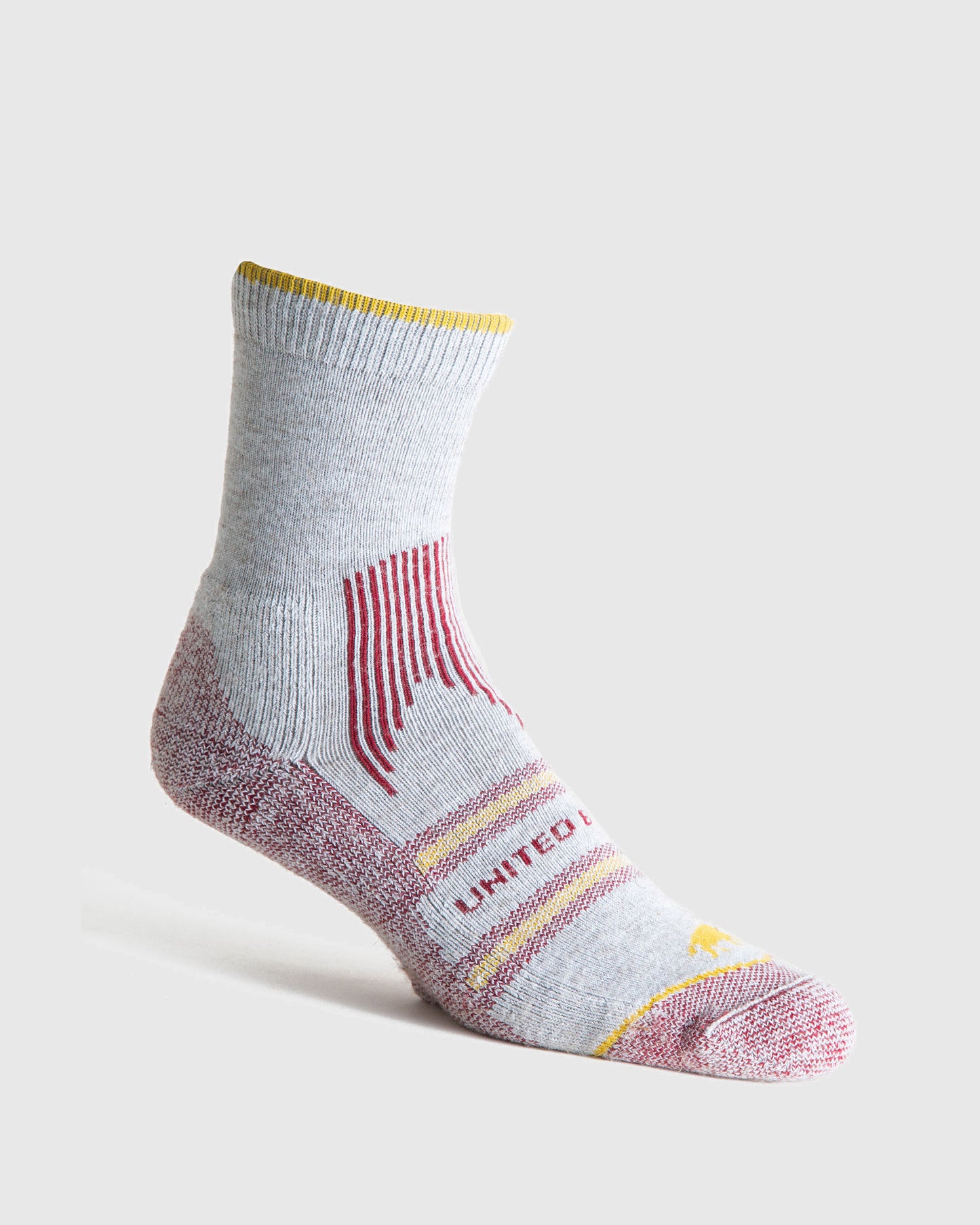 Red Bison Wool Trail Sock (Angle): Light grey quarter-length sock with red accents, yellow trim, and stripe details