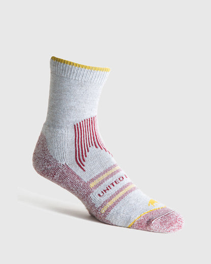 Red Bison Wool Trail Sock (Angle): Light grey quarter-length sock with red accents, yellow trim, and stripe details