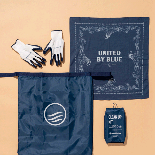 Navy Reusable DIY Cleanup Kit (Flat-lay): Navy bandana, gloves, tote bag, and small pouch on beige background