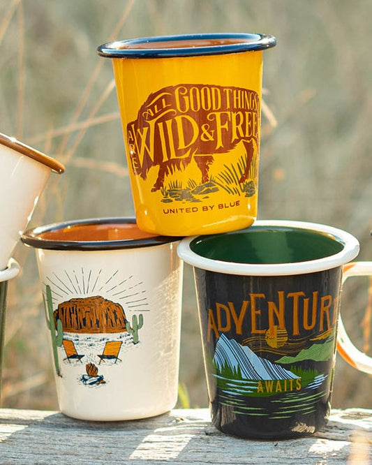 Cream Desert Chill Enamel 12 Oz. Tumbler (Lifestyle): Cream enamel tumbler with desert campfire scene, alongside two others