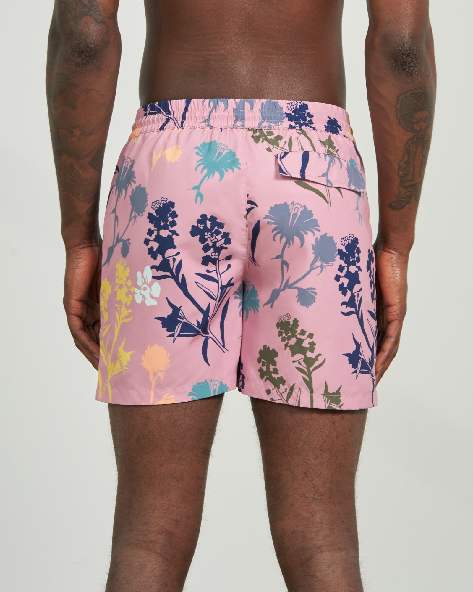 Foxglove Recycled Swim Trunk - 5" (Back): Pink floral swim trunks, back view, elastic waistband, single back pocket