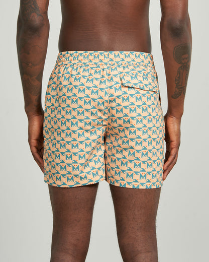 Buff Orange Recycled Swim Trunk - 5" (Back): Back view showing teal geometric butterfly print, elastic waistband, back pocket