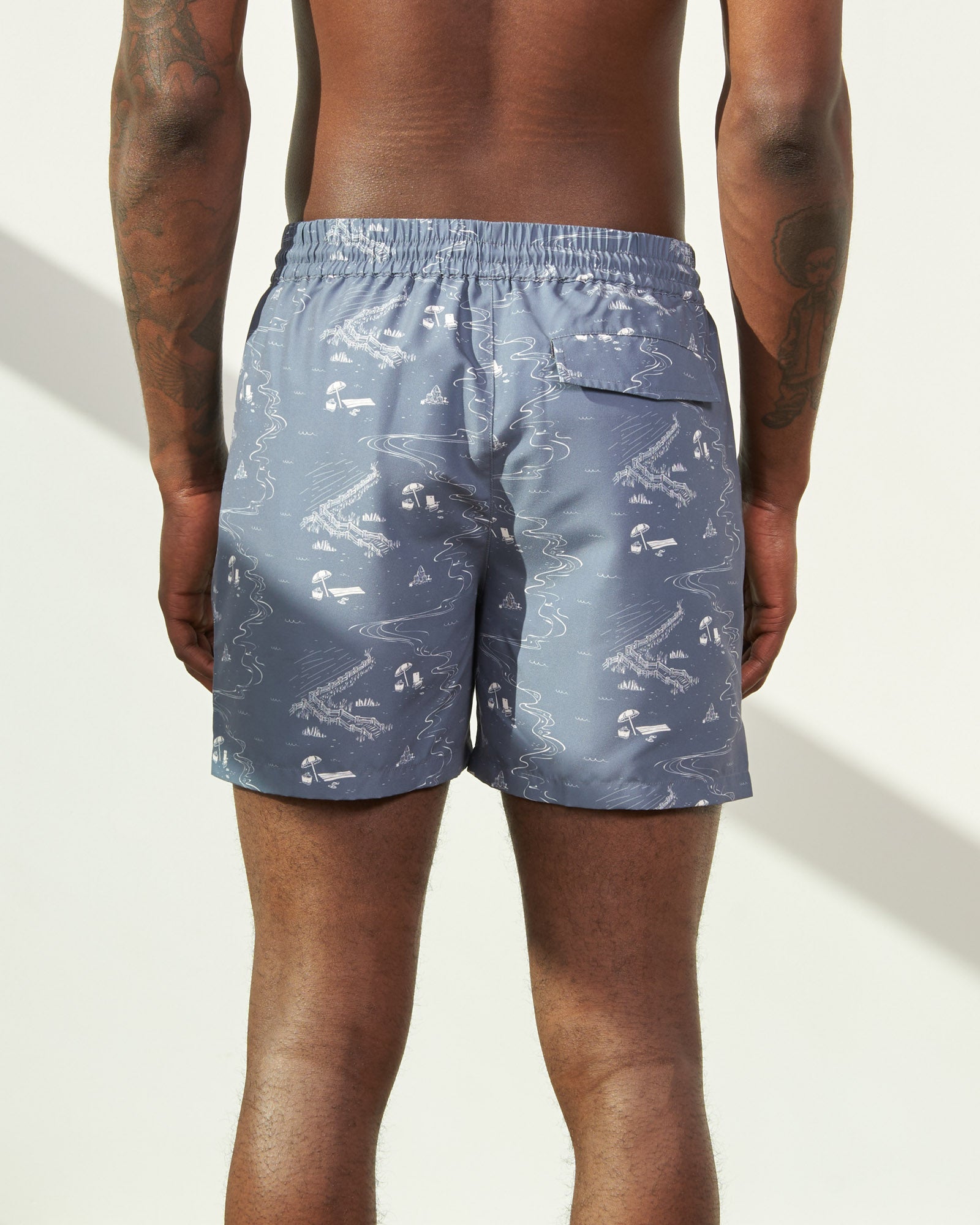 Stone Blue Recycled Swim Trunk - 5" (Back): Back view of slate blue patterned swim trunks with back pocket