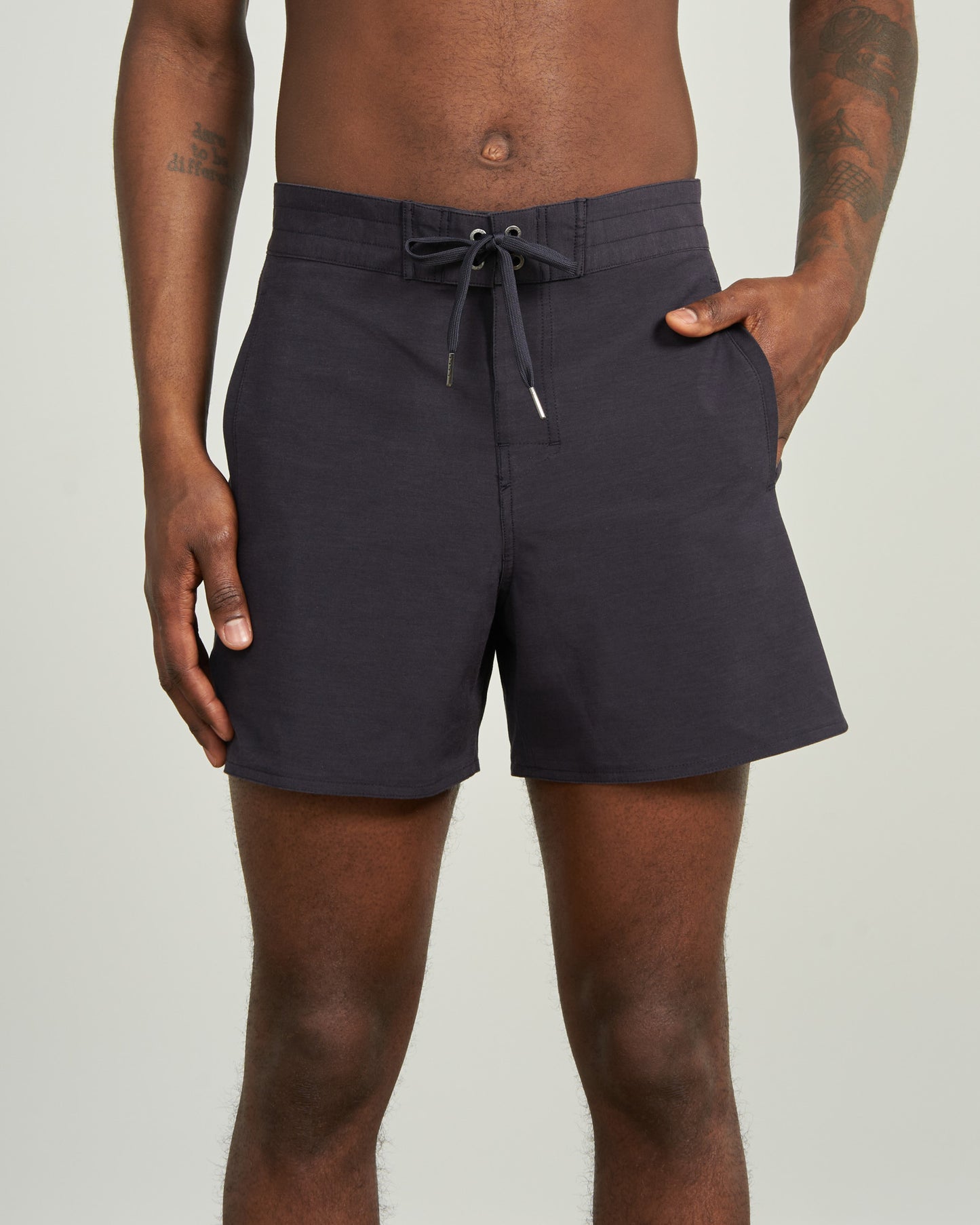 Night Sky The Responsible Board Short - 5" (Front): Dark navy board shorts with drawstring waist and side pocket, worn by man
