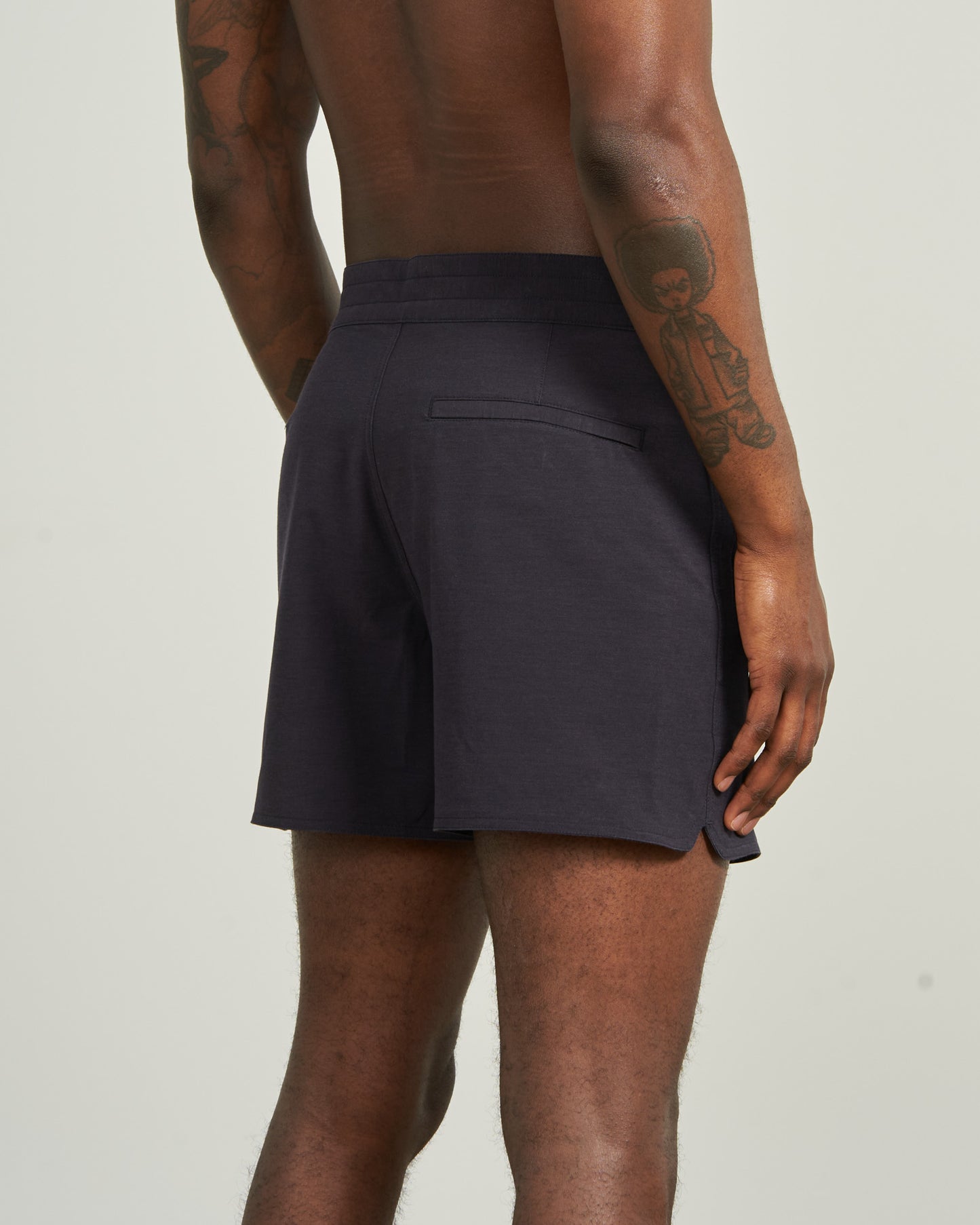 Night Sky The Responsible Board Short - 5" (Back): Dark navy shorts, back welt pocket, side vent, worn by tattooed model