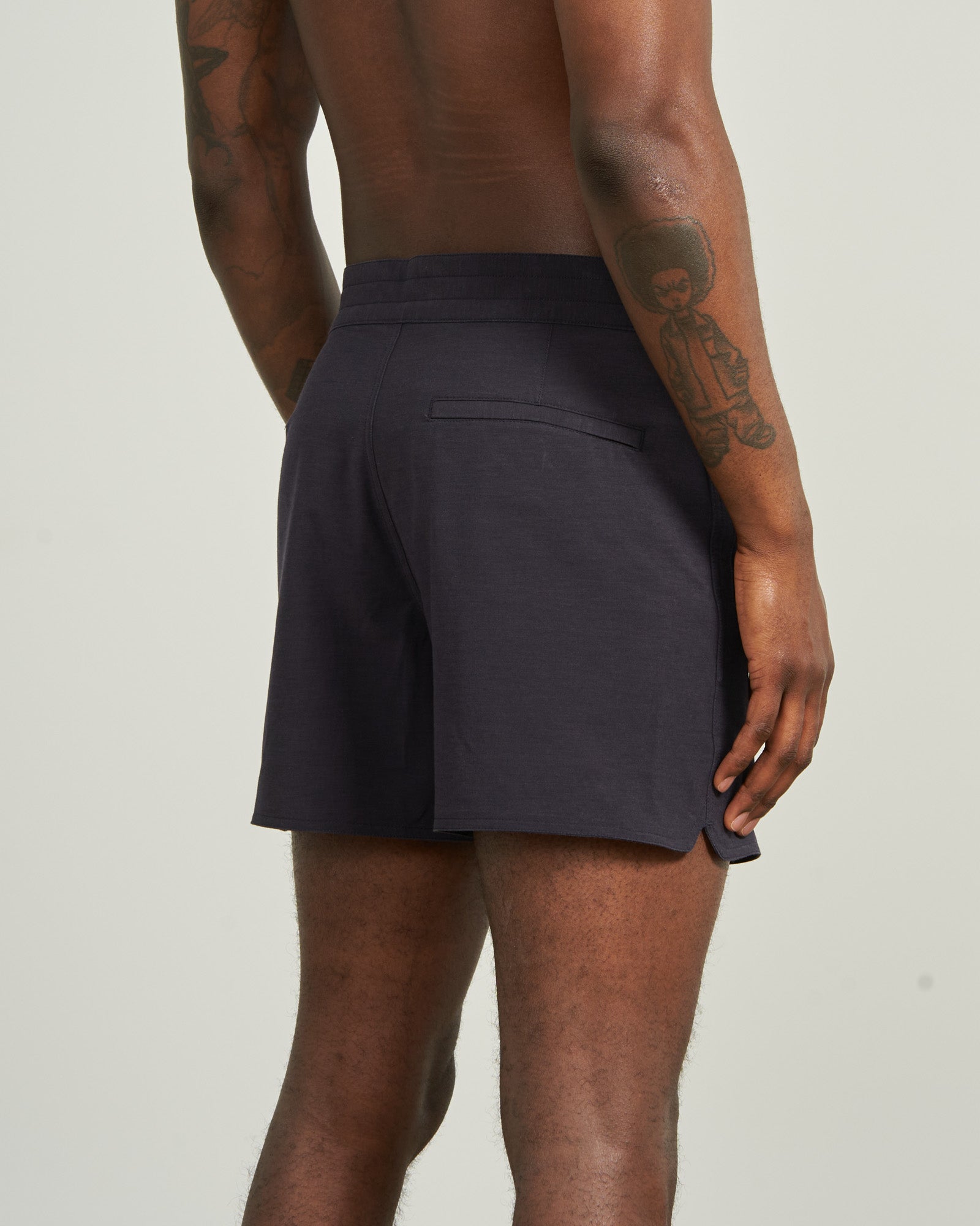 Night Sky The Responsible Board Short - 5" (Back): Dark navy shorts, back welt pocket, side vent, worn by tattooed model