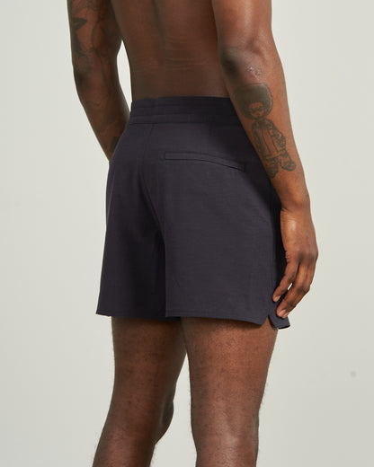 Night Sky The Responsible Board Short - 5" (Back): Dark navy shorts, back welt pocket, side vent, worn by tattooed model