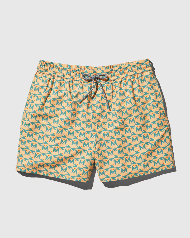 Buff Orange Recycled Swim Trunk - 5" (Flat-lay): Yellow swim trunks with teal geometric cat print and drawstring waist