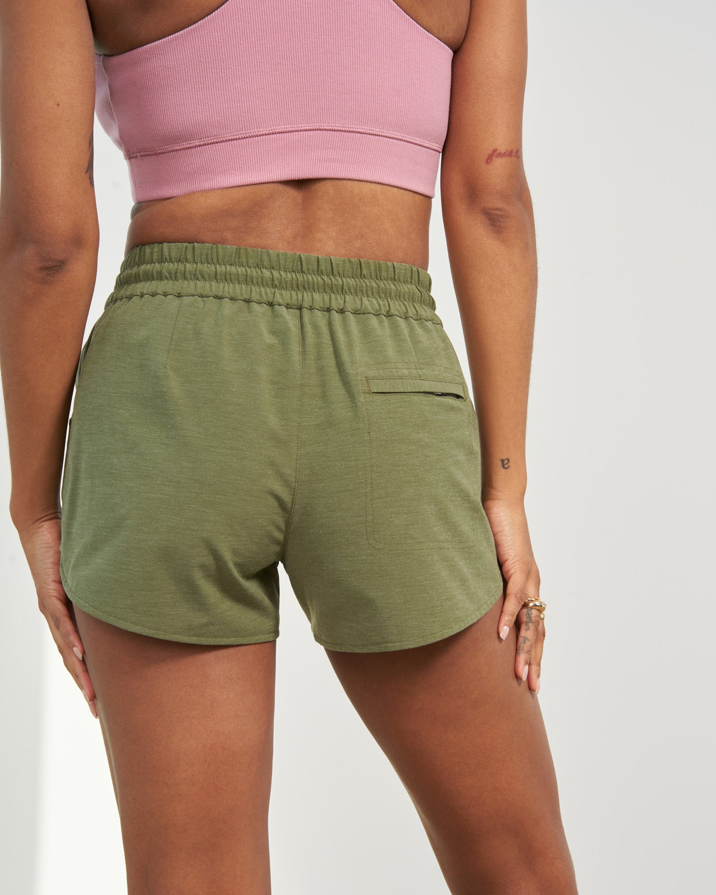 Cypress The Responsible Swim Short (Back): Back view of olive green shorts with smocked waistband and zip pocket